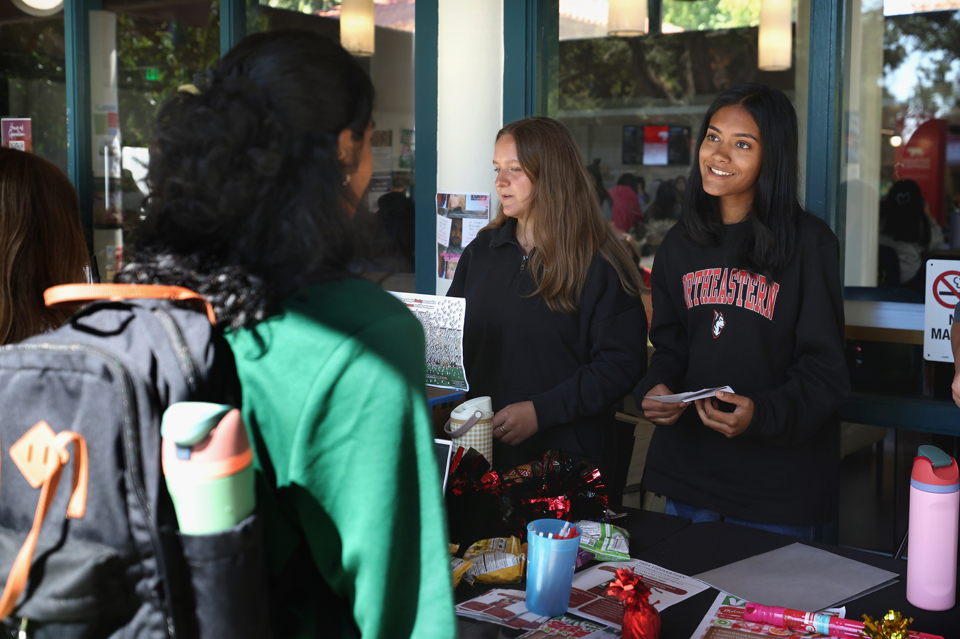 Students talk during an election tabling event.