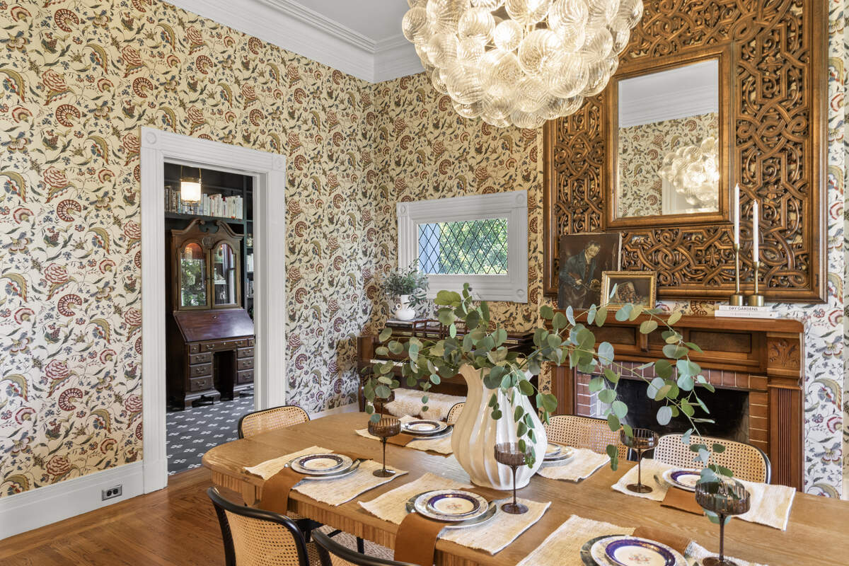Parisian wallpaper, saturated paint colors, natural stone, unlacquered brass and a mix of antique and contemporary furnishings work well together in the home.