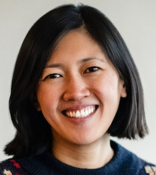 smiling woman with dark hair in a bob