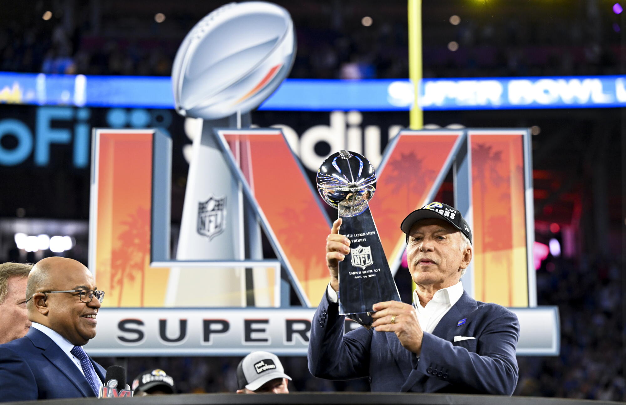 Rams owner Stan Kroenke holds onto the Lombardi Trophy after his team beat the Bengals to win the Super Bowl in 2022.