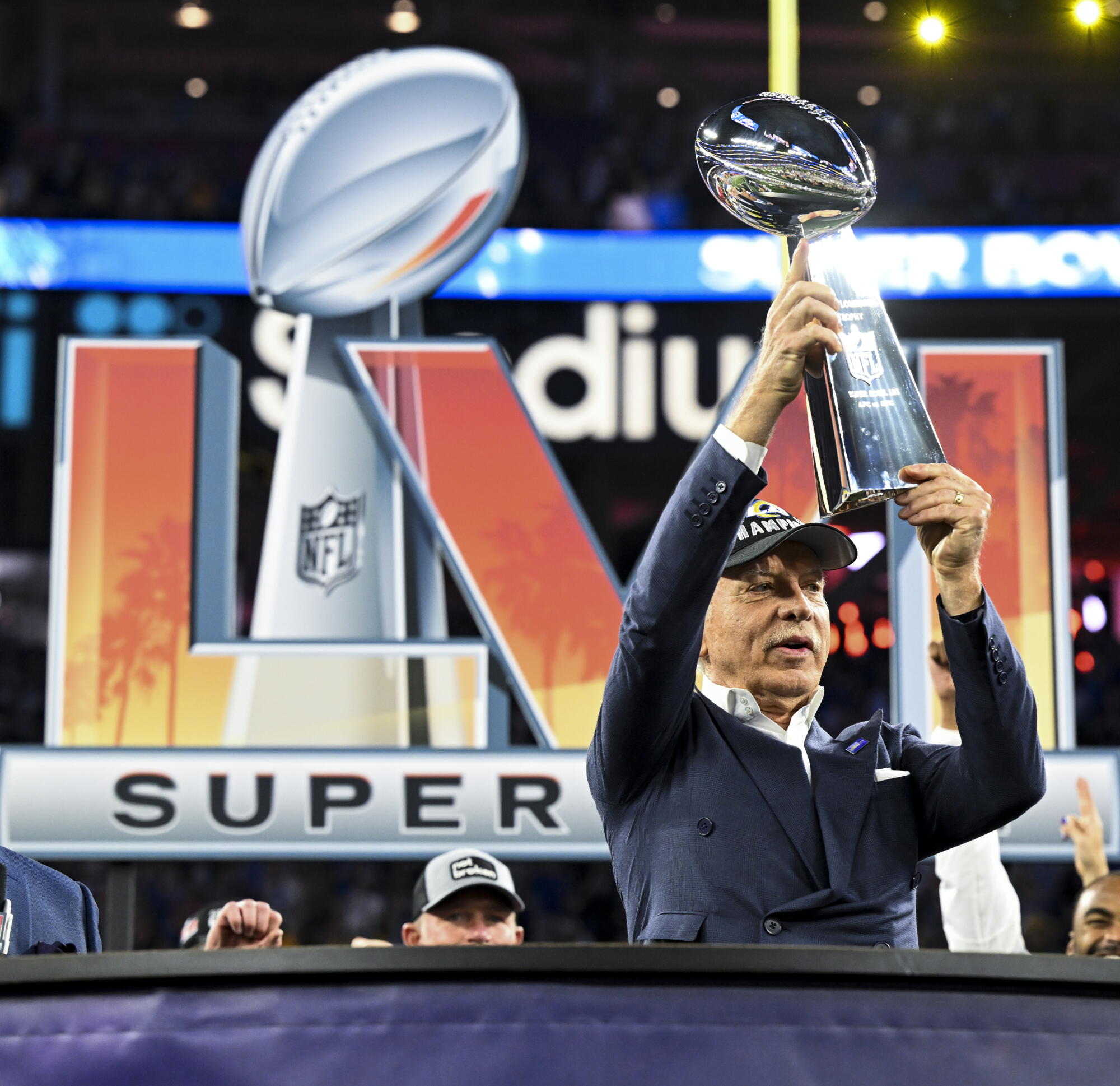 Rams owner Stan Kroenke holds up the Lombardi Trophy after his team beat the Bengals to win the Super Bowl in 2022. 