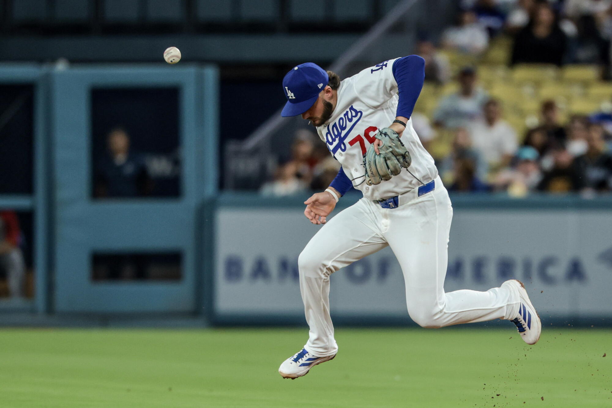 Dodgers second baseman Alex Freeland chases the ball as the Cardinals' Nathan Church hits an RBI at Dodger Stadium.
