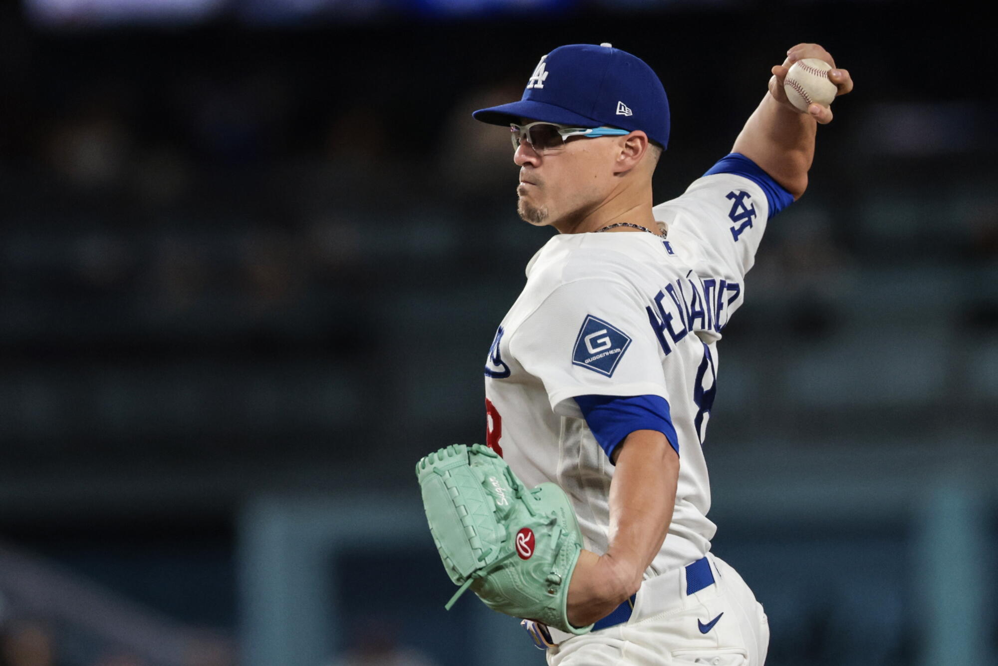 Dodgers utility player Kiké Hernández pitches during the ninth inning of a blowout loss to the Cardinals.