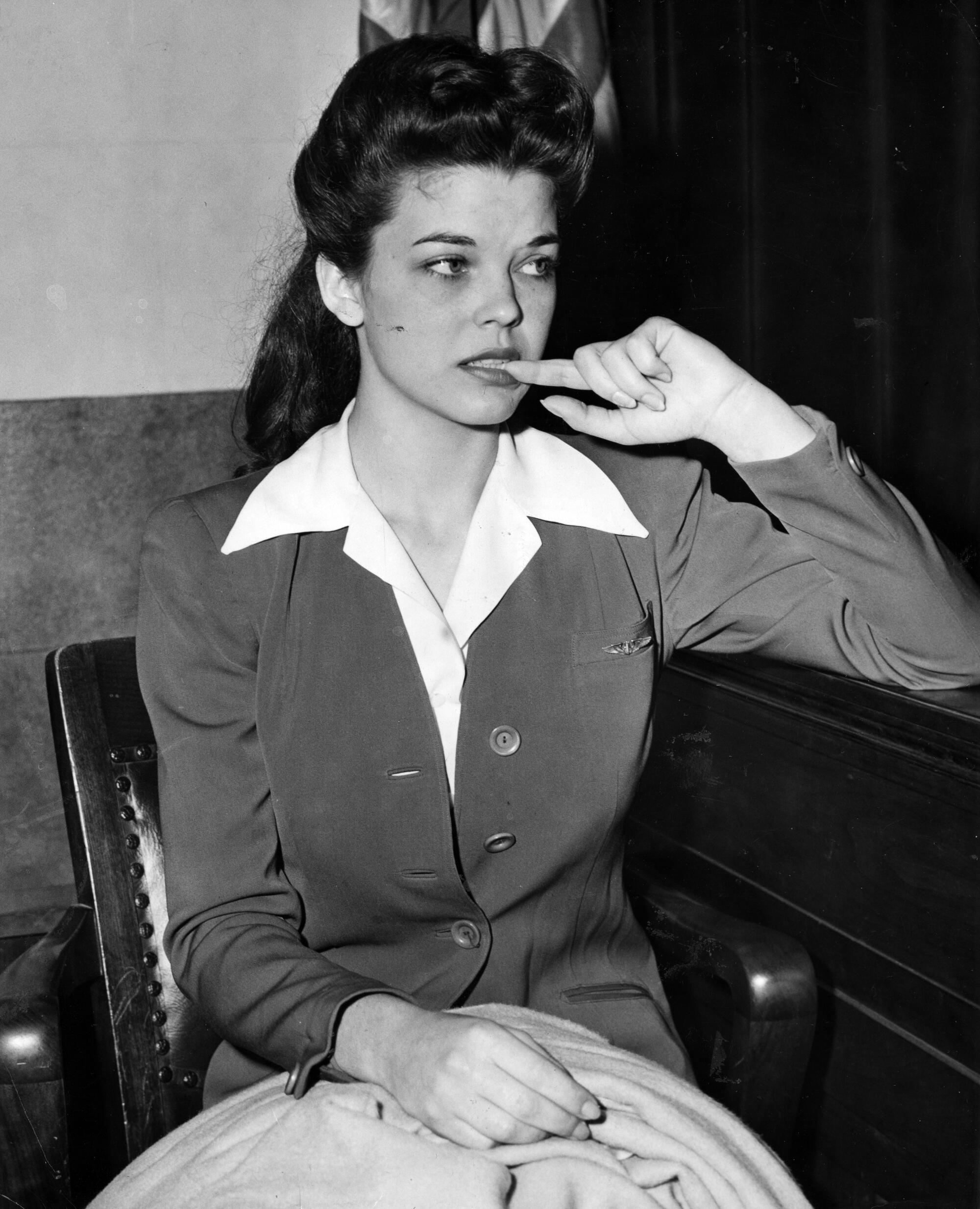 Peggy Satterlee, 17-year-old night club dancer, sits nervously on the witness stand as she testifies on Jan. 19, 1943.