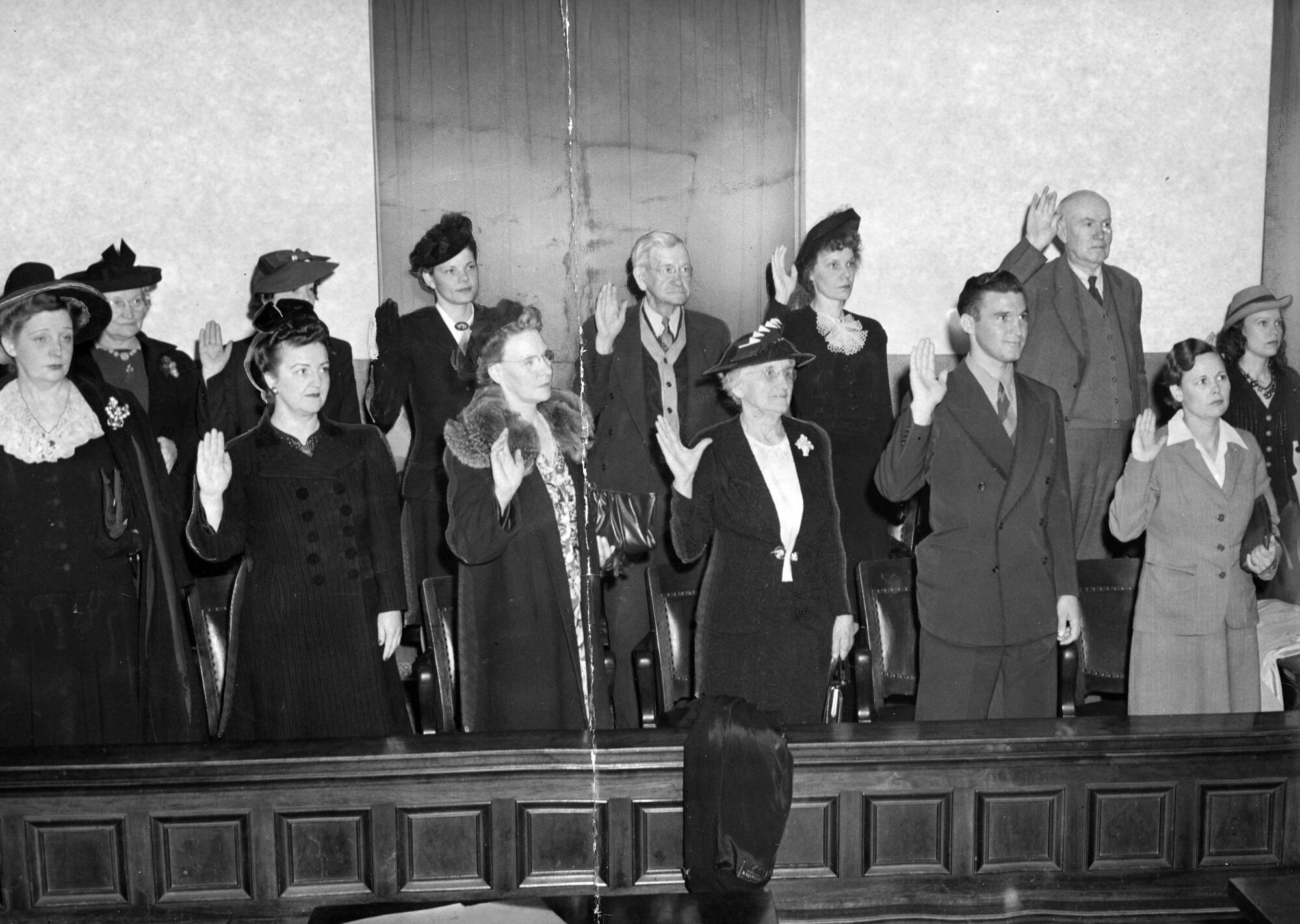 Jurors selected for the Errol Flynn trial on morals charges take the jury oath on Jan. 13, 1943.