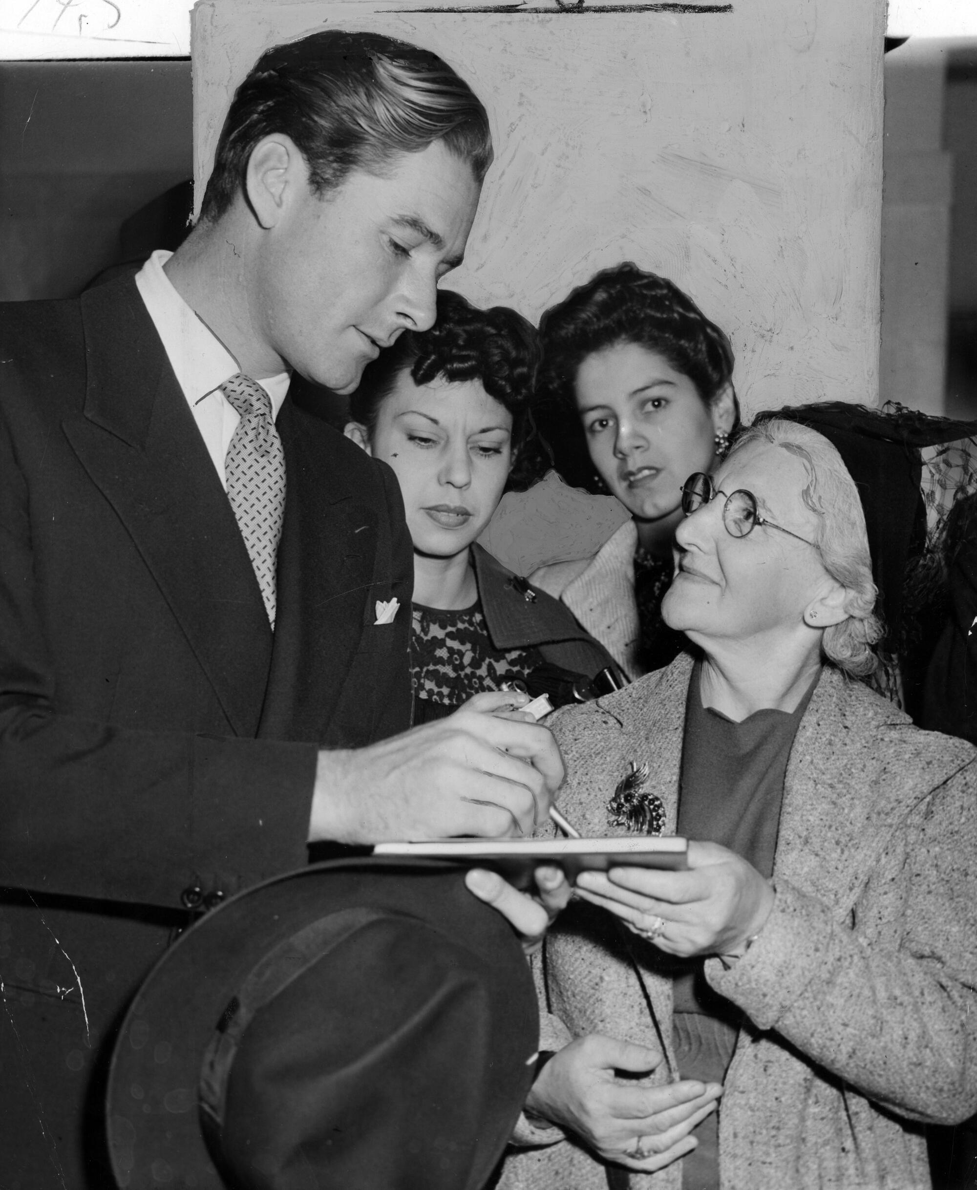 Ethel Dreyfus gets the autograph of Errol Flynn.