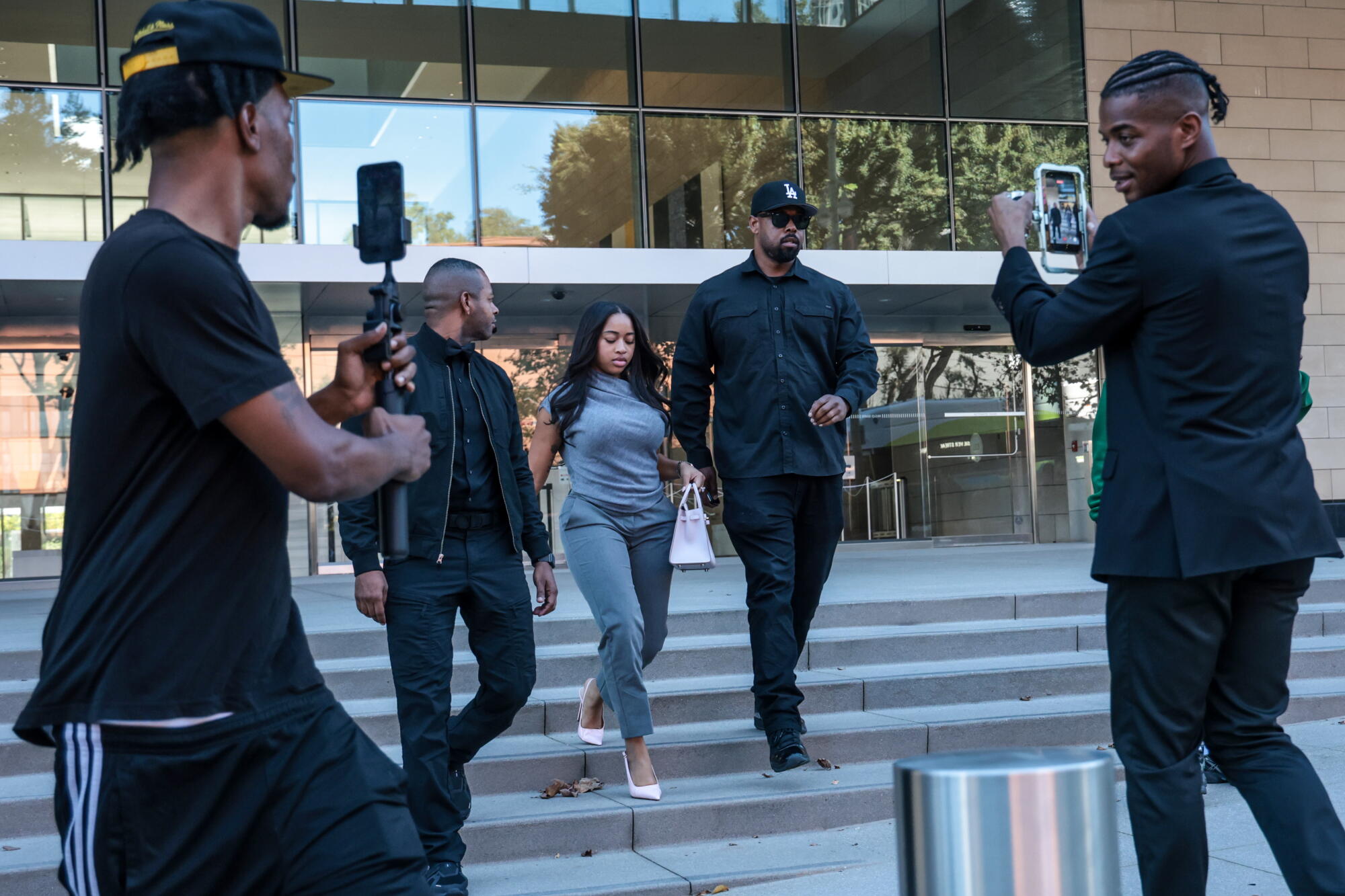 Lil Durk's wife, India Royale, leaves the courtroom.