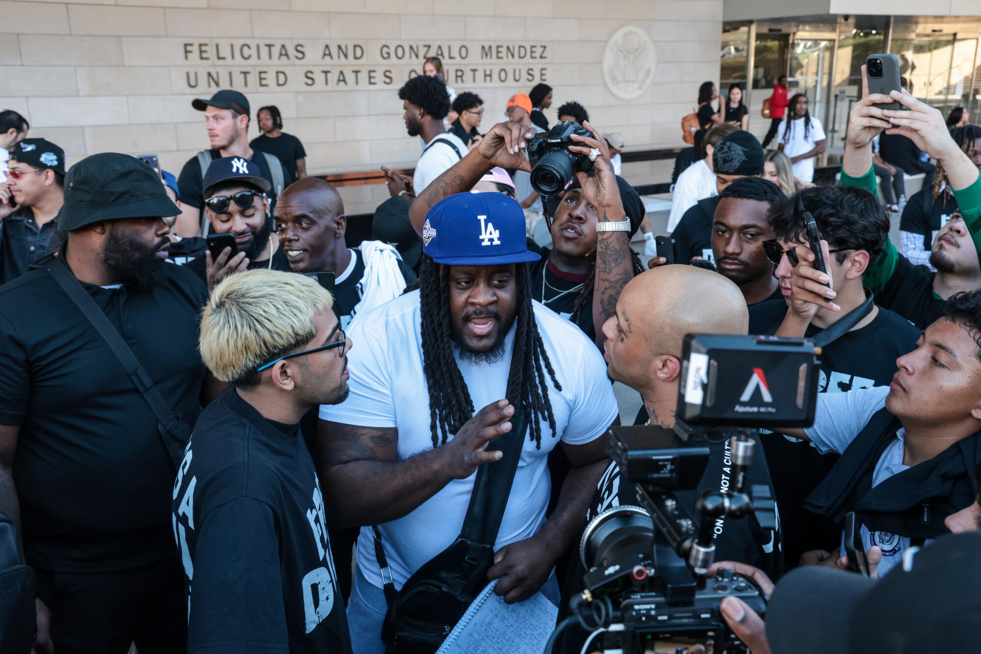 Ceddy Nash is interviewed outside federal court in Los Angeles.
