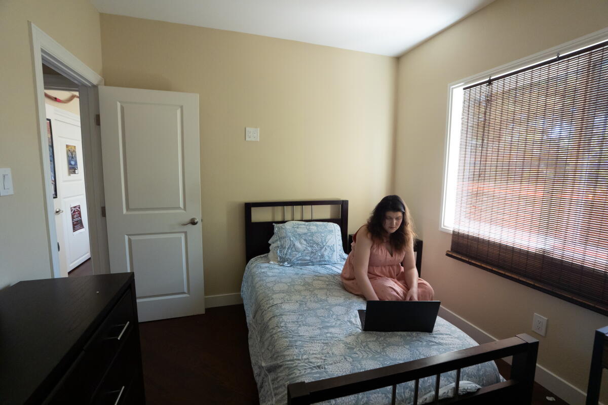 Sarah Lawlor in her room she rents from Rudy Ramirez in Foster City.