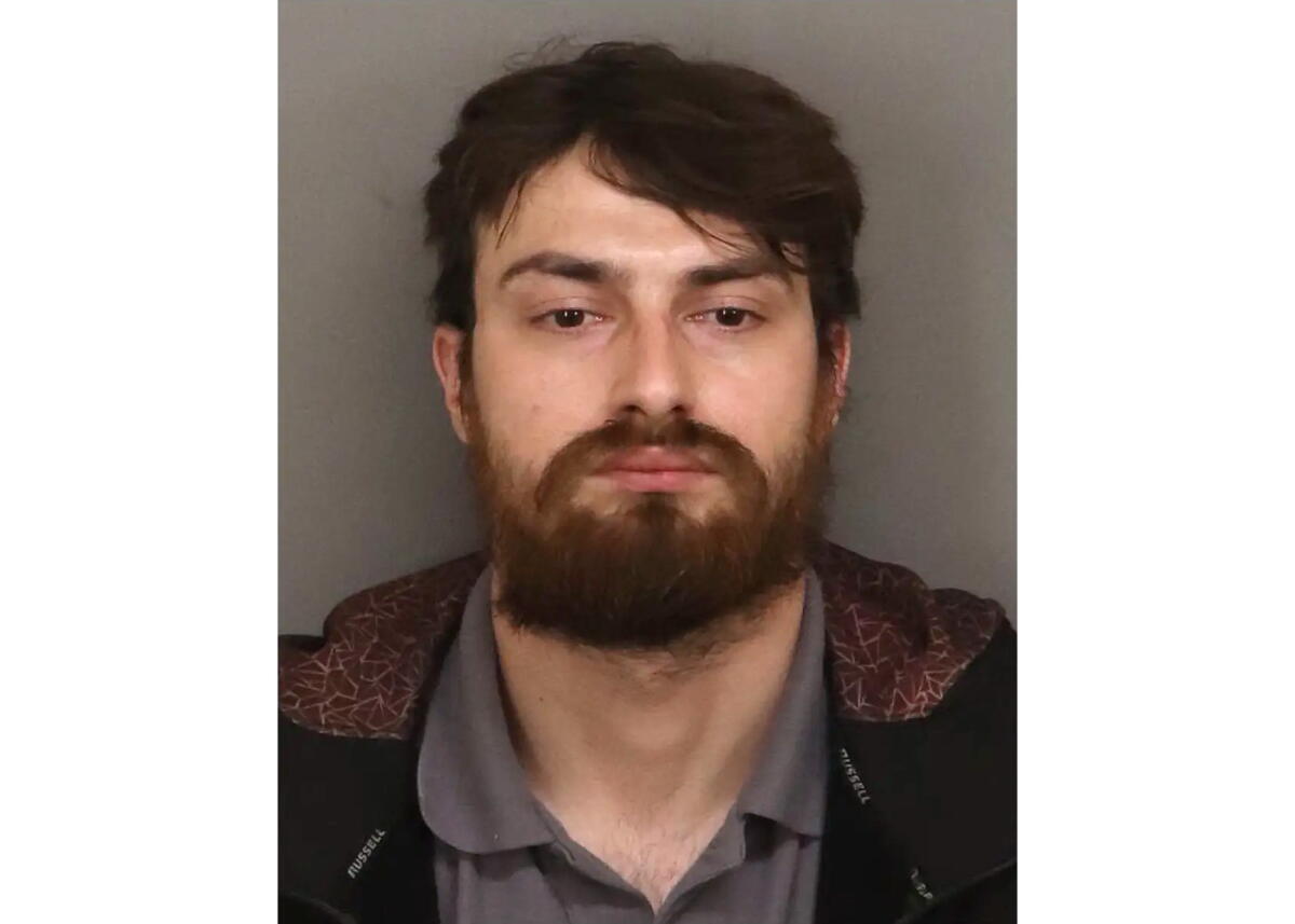 Booking photograph of Chamel Abdulkarim.