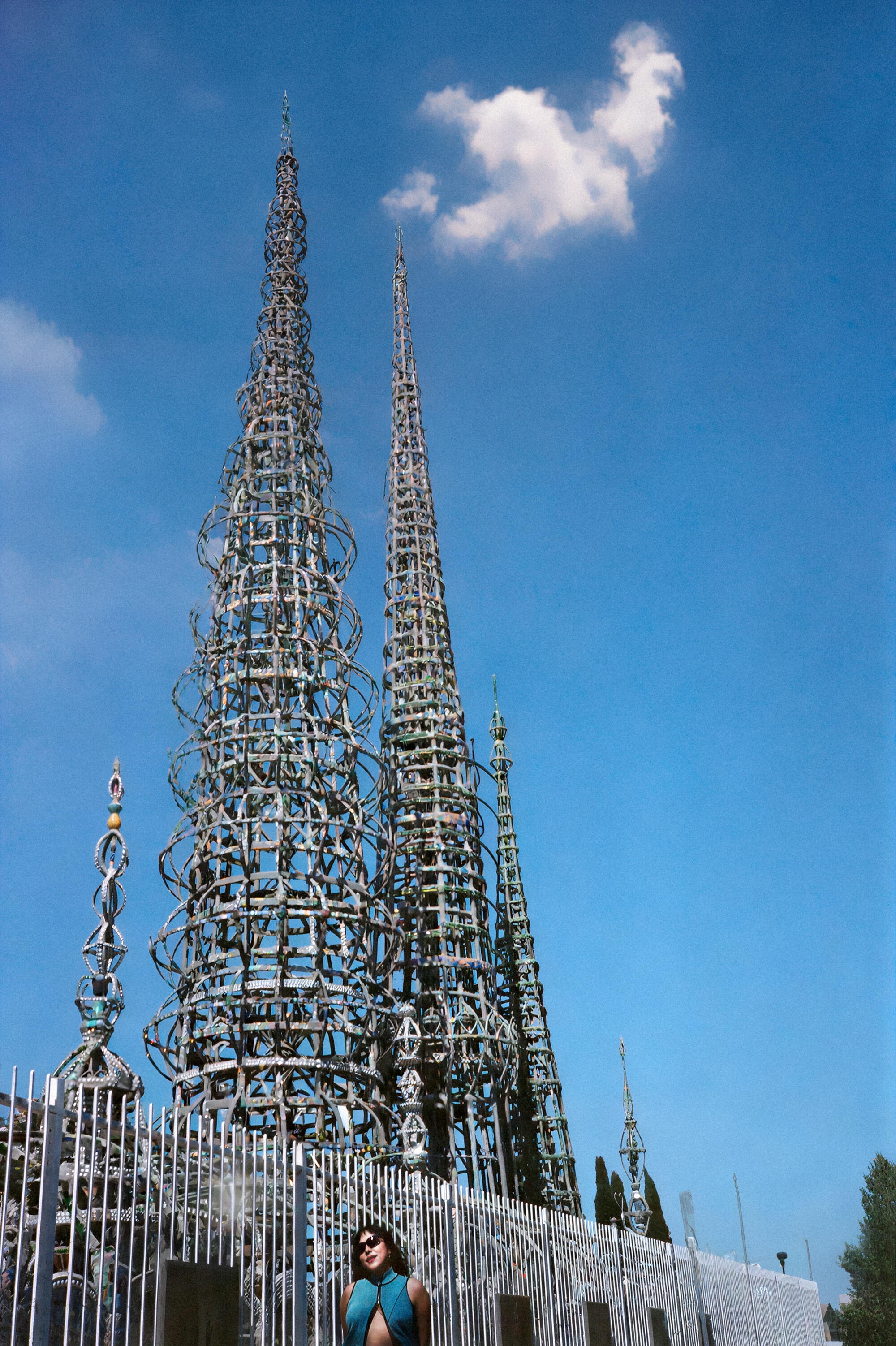 Holcomb in front of Watts Towers in Watts, wearing Desigual and styled by Jocelyn Corona.