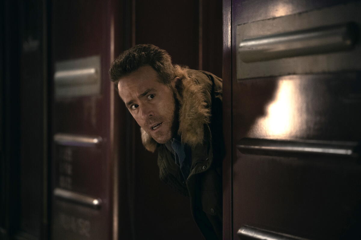 Ryan Reynolds pokes his head through a door in "Mayday."