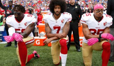 Eli Harold, Colin Kaepernick, and Eric Reid of the San Francisco 49ers kneel in protest during the anthem in October 2016 in New York.