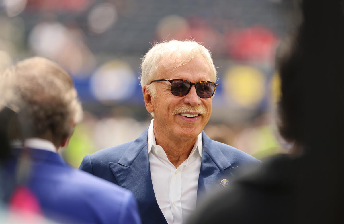Rams owner Stan Kroenke walks on the field before his team plays the Houston Texans at SoFi Stadium on Sept. 7.