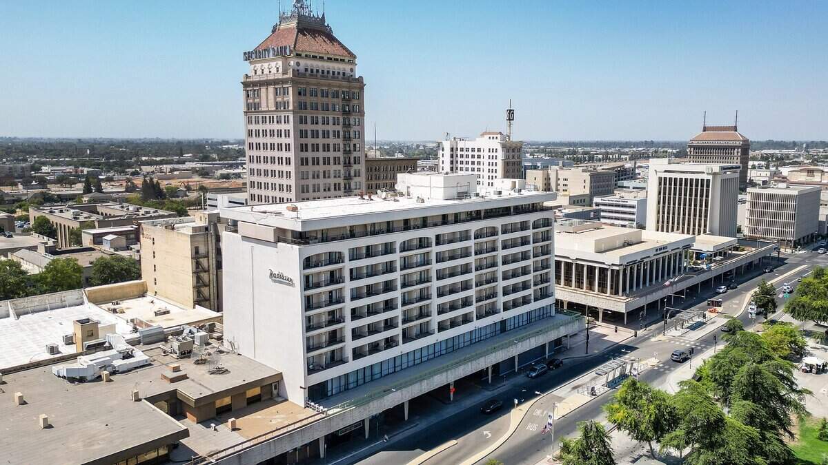 The Radisson Hotel building, center, on Van Ness in downtown Fresno is again listed for sale. It was listed last fall with a price of $14.9 million, then it was taken off the market. On Aug. 21 it was listed for sale again, this time for $19.5 million.