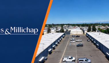 a company logo and aerial view of an industrial complex