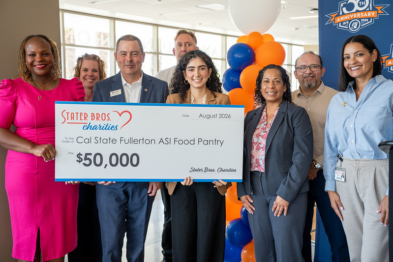 Representatives from Cal State Fullerton, Associated Students Inc. and Stater Bros. Charities present a $50,000 check for the ASI Food Pantry.