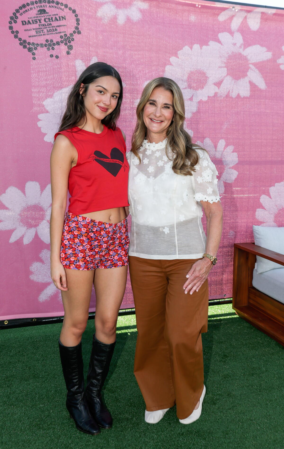 Olivia Rodrigo and Melinda French Gates attend the Daisy Chain Fields festival.