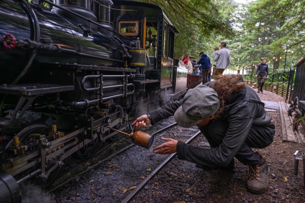 Engineer in training Galen O'Regan applies oil to the steam train at the Redwood Valley Railway at Tilden Regional Park in Orinda, Calif., on Monday, Aug. 31, 2026. Visitors are treated to a 12-15 minute ride on a 15-inch gauge track which was built back in 1952. (Jose Carlos Fajardo/Bay Area News Group)