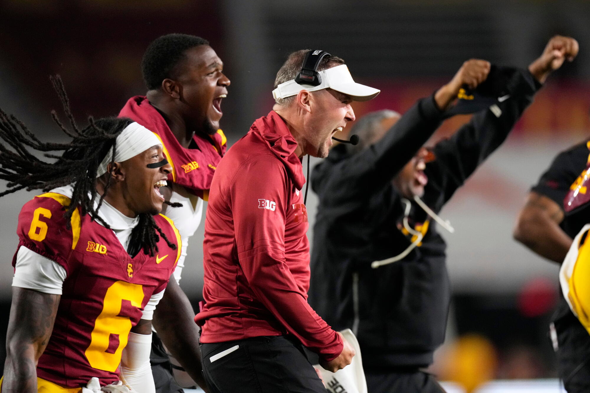 USC coach Lincoln Riley, center, celebrates during the Trojans' 39-0 win over Fresno State at the Coliseum.