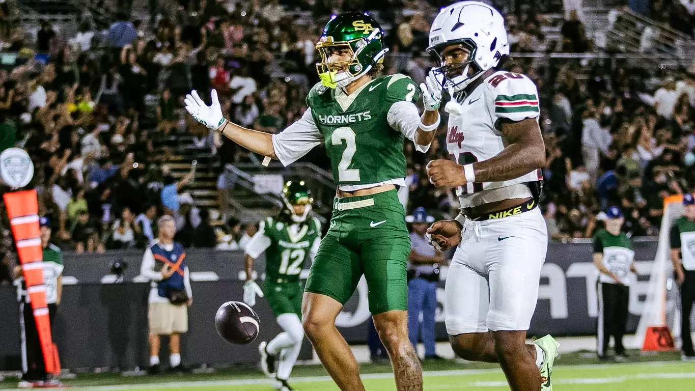 Matt Coleman looks to the crowd after his second TD