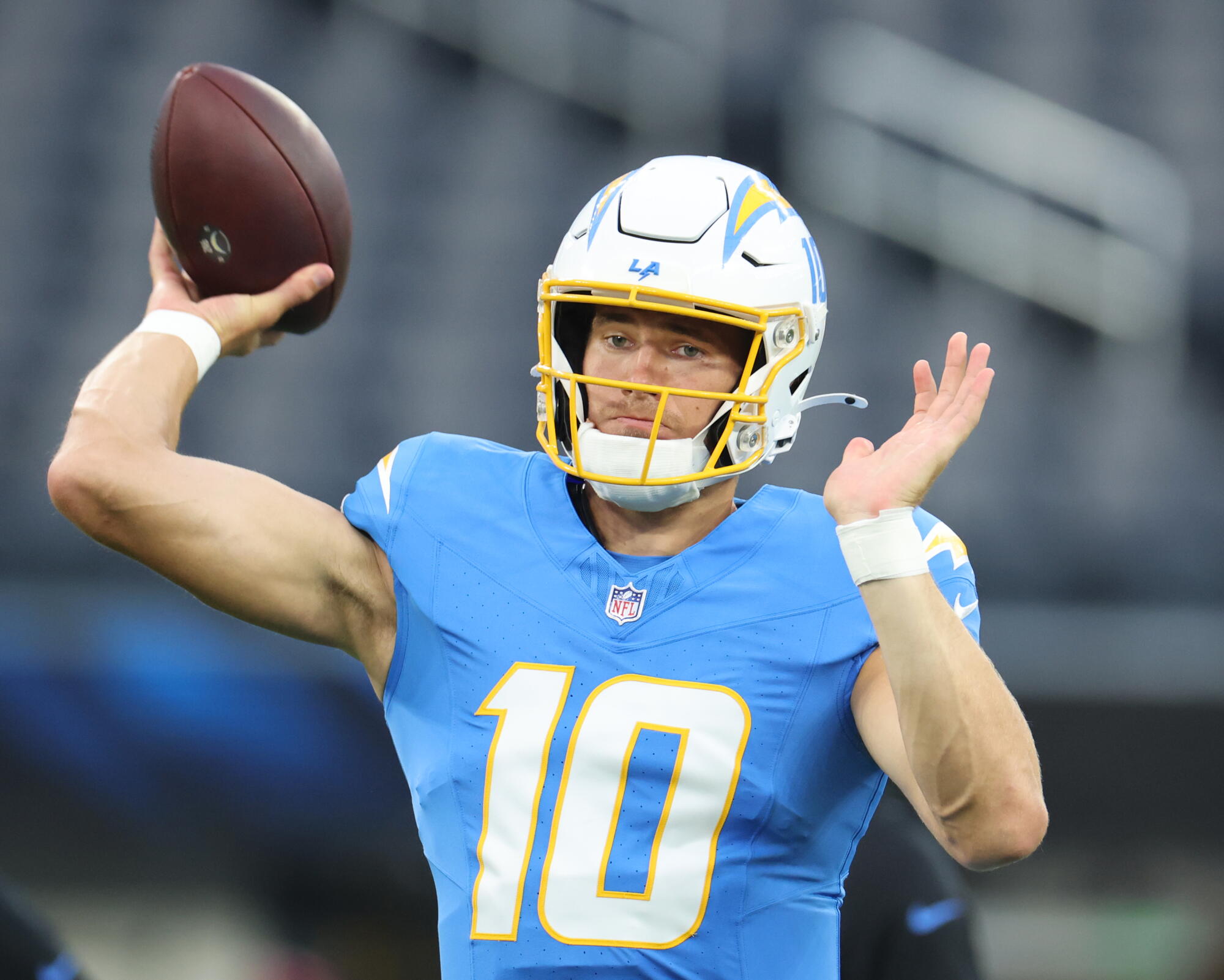 Chargers quarterback Justin Herbert passes before a preseason game against the Rams.