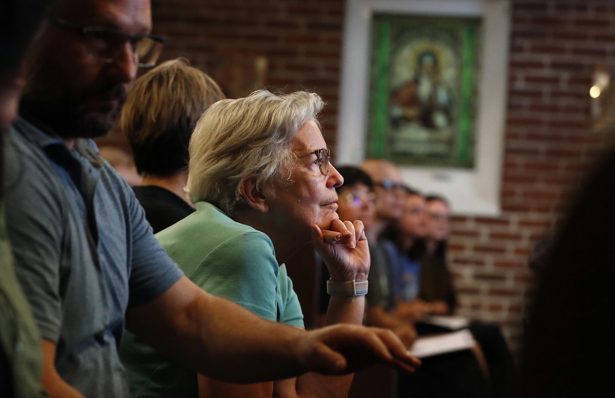 Barbara Castle listens to speakers during a town hall meeting on a possible small-scale data center in Hanford.