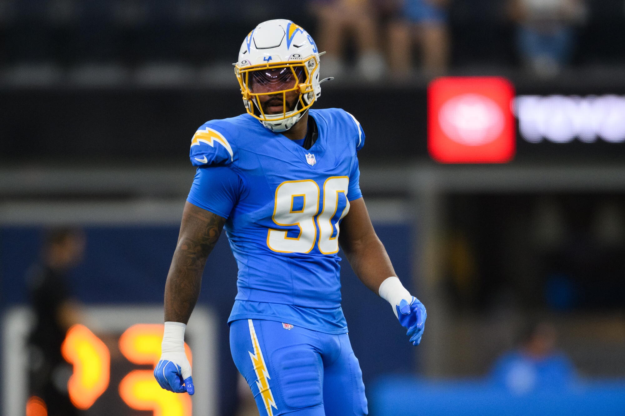 Chargers linebacker Akheem Mesidor walks on the field during a preseason game against the Rams on Aug. 27.