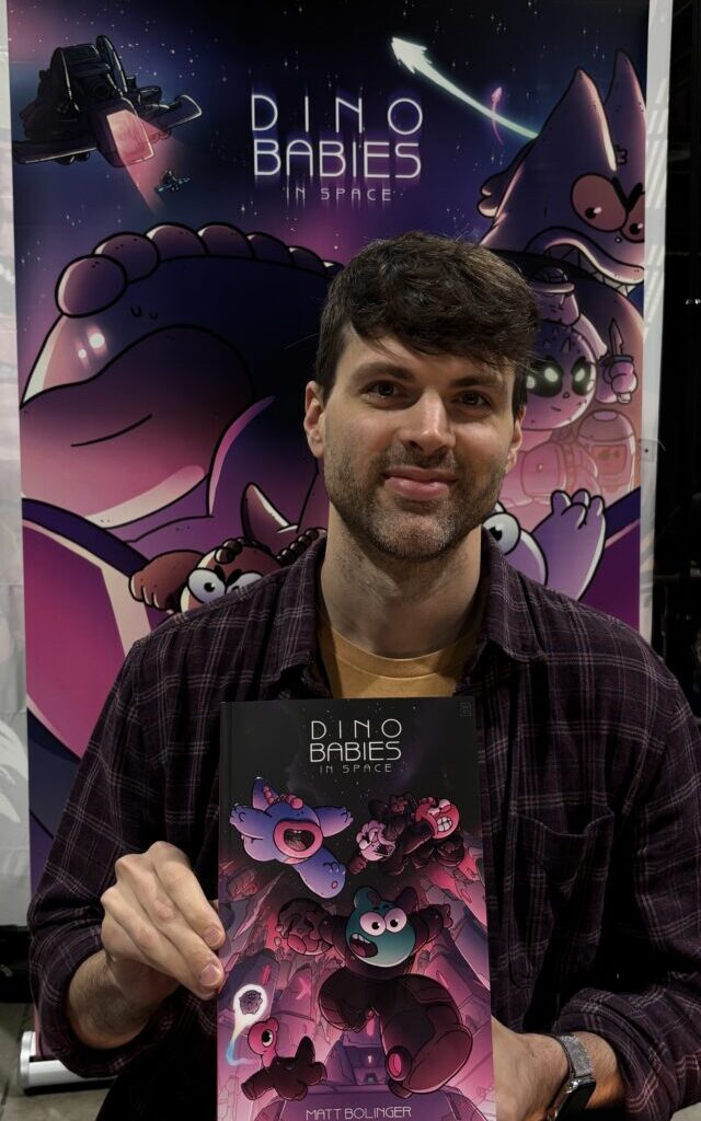 Matt Bolinger holding Dino Babies in Space