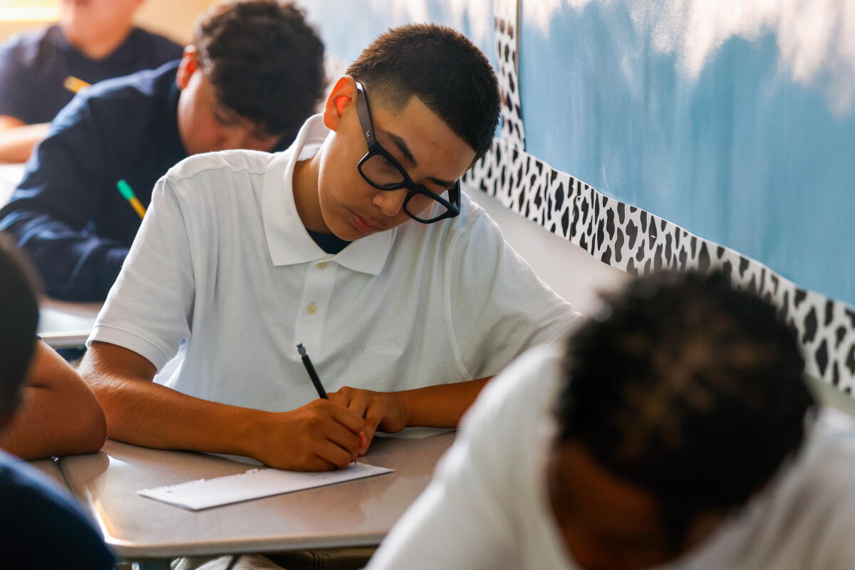 Eighth grader Erick works on a morning activity during eighth grade teacher Melody Stambaugh’s class.