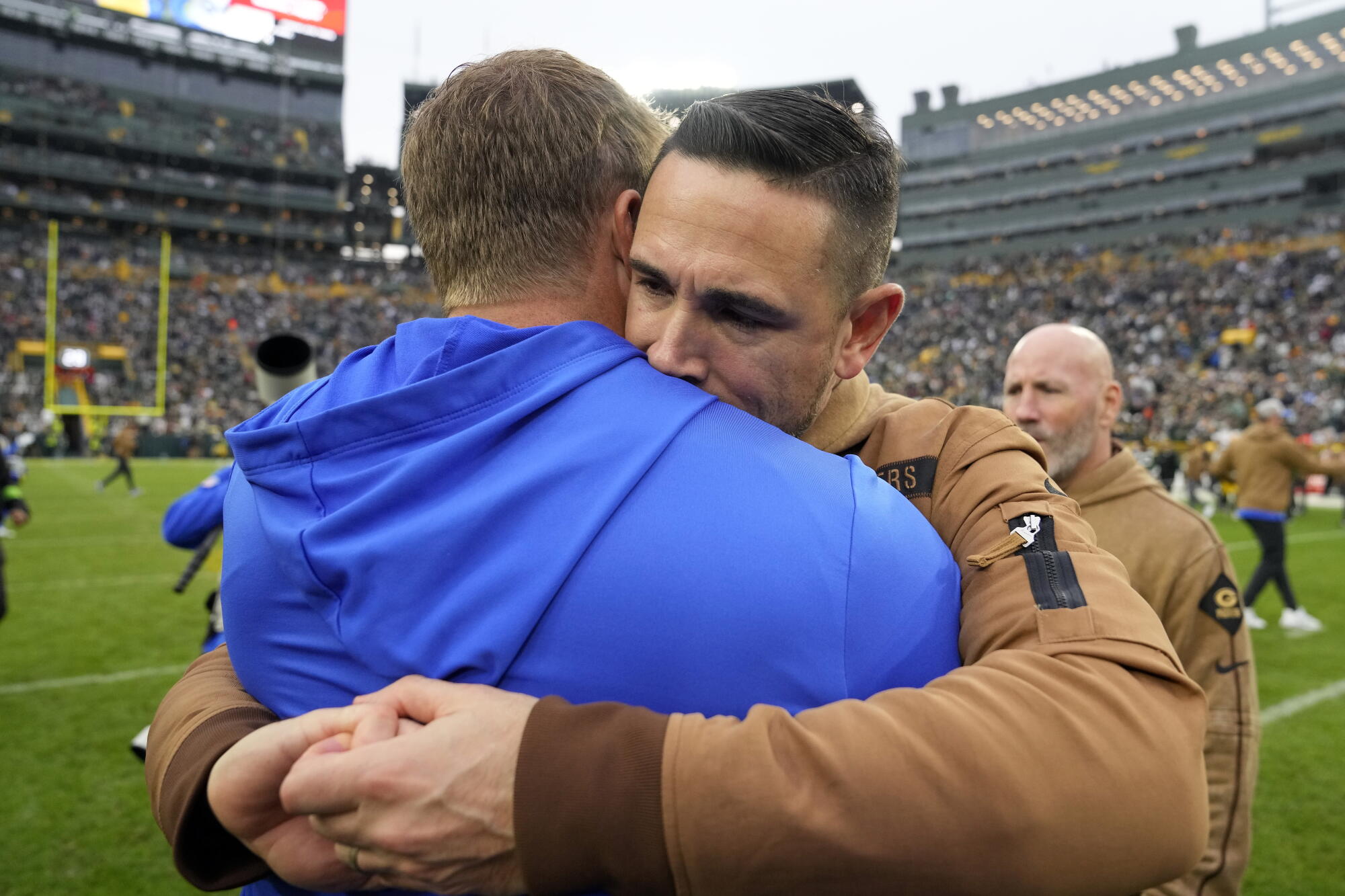 Green Bay Packers coach Matt LaFleur, right, hugs Rams coach Sean McVay following a game at Lambeau Field in November 2023.