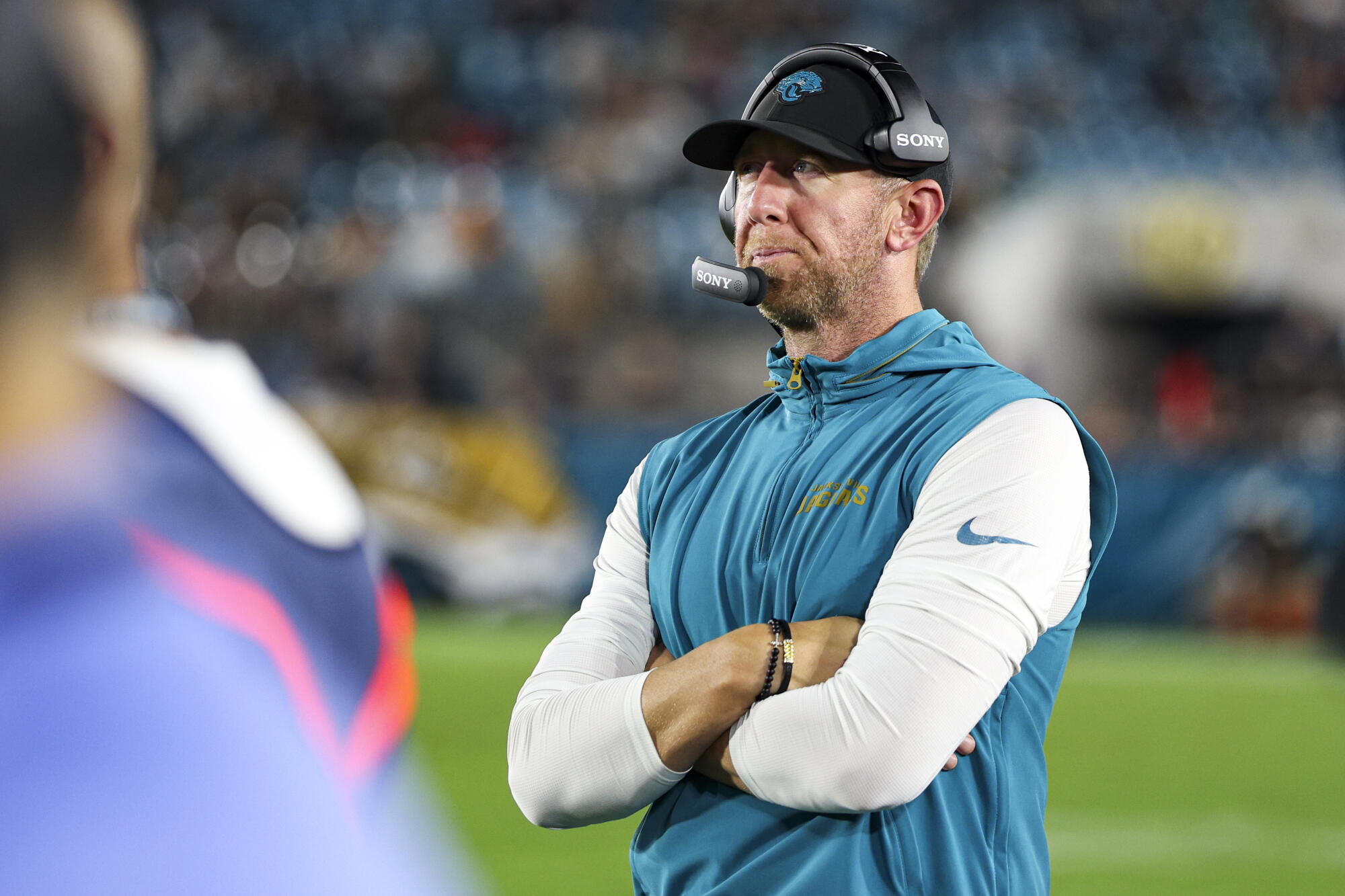Jacksonville Jaguars coach Liam Coen stands on the sideline during a preseason game.