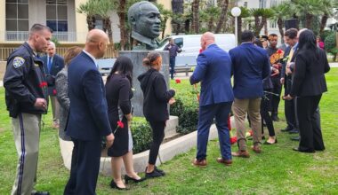 a gathering of people at a martin luther king, jr. statue at a greenspace