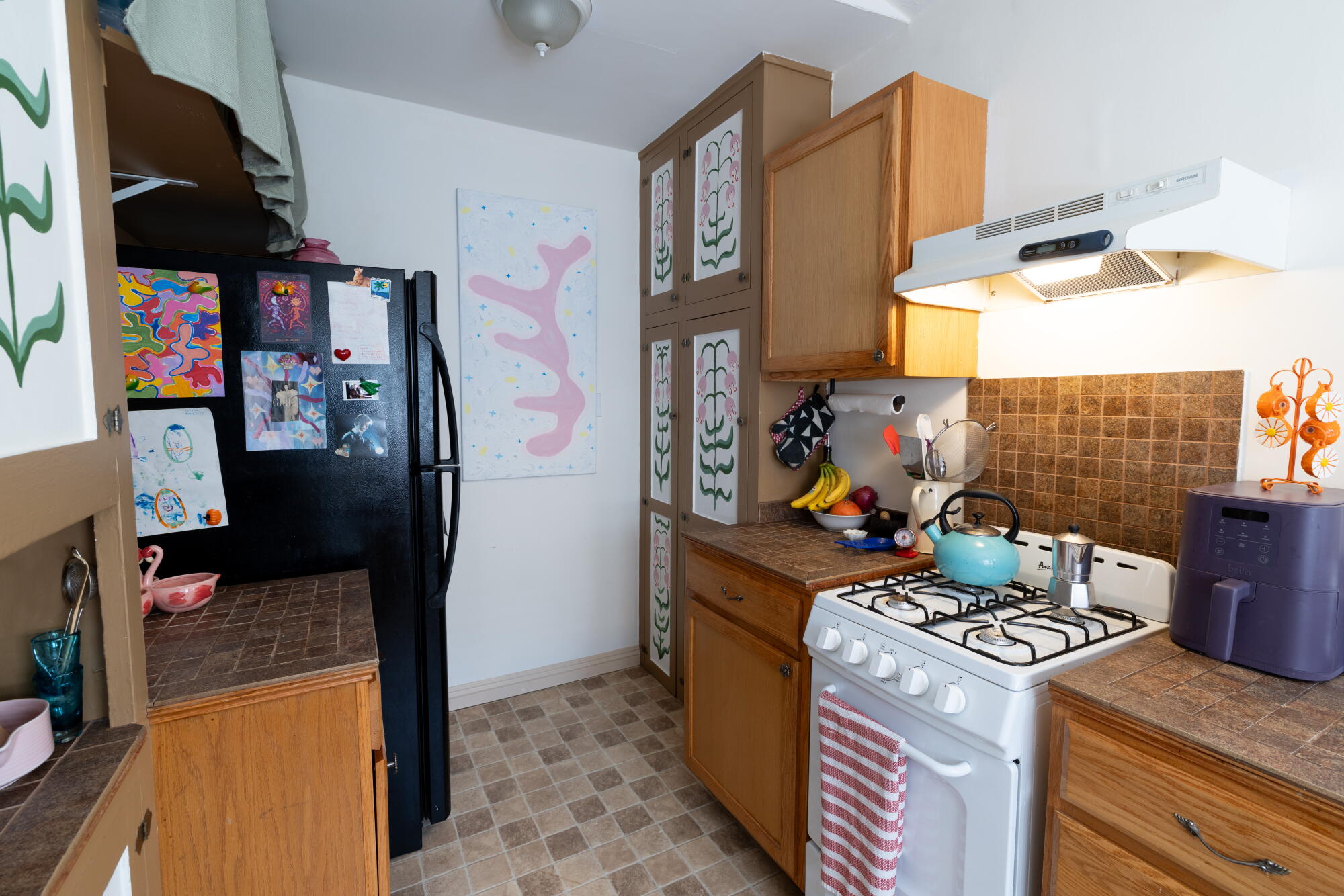 Morgan Jordan's kitchen has some of her artistic touches on the cabinets.
