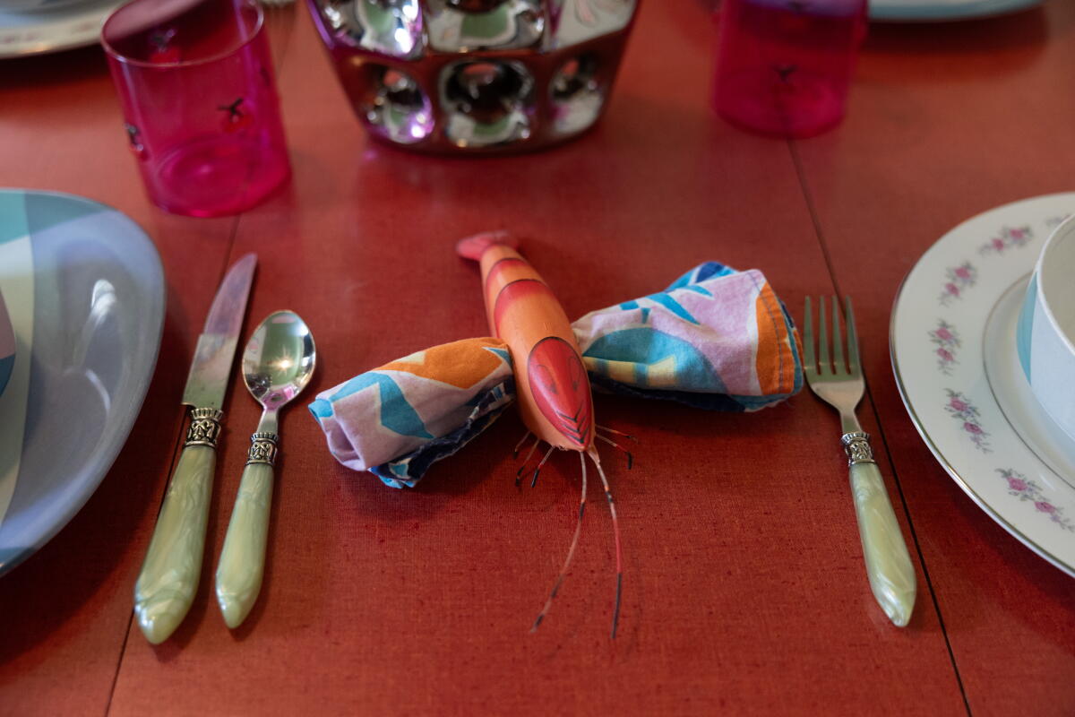 Jordan's lobster napkin cuff holder at the dining table in her home.