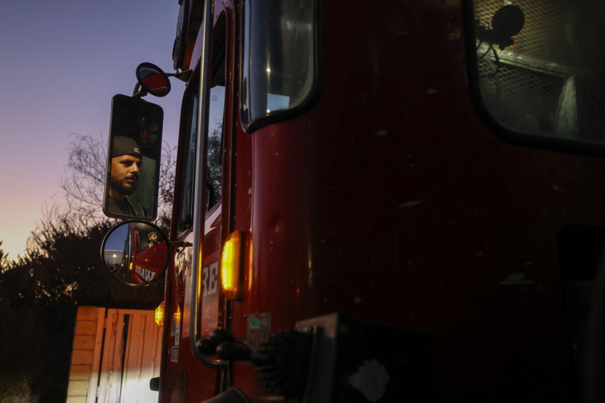 Angel Olea drives a sanitation truck