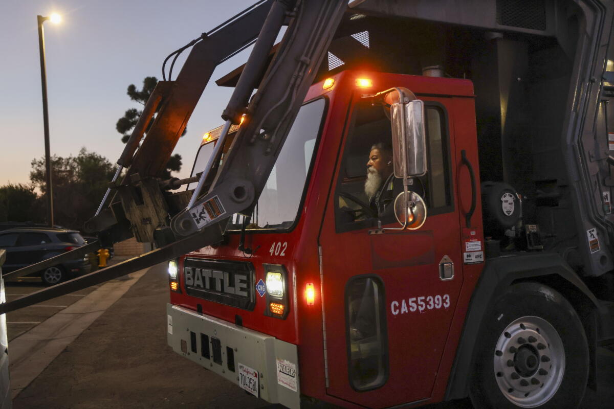 Salomon Olea drives a sanitation truck