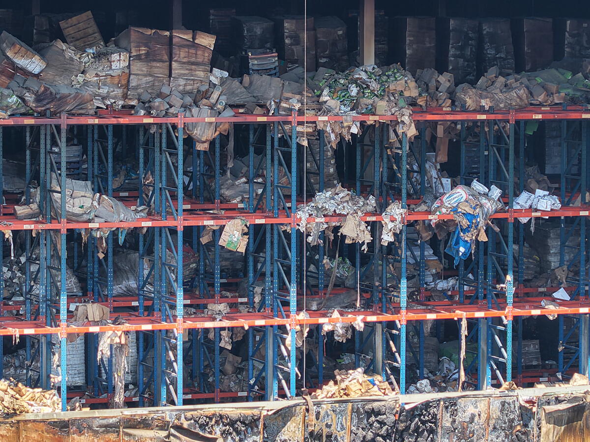 An aerial view of stacks of burned and salvaged goods