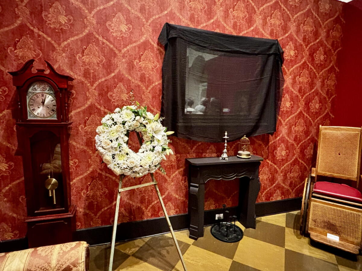 A display at Final Rites at Fullerton Museum displays the practice of covering mirrors during a time of mourning.