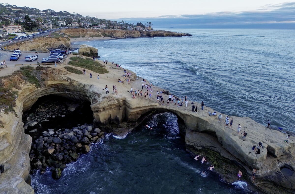 A rocky outcrop where divers jump off the cliffs into the water at Sunset Cliffs in the Ocean Beach area of San Diego.