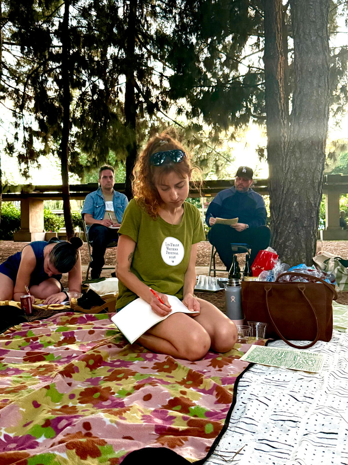 Willa Lane writes in a notebook at the closing Los Feliz Writers Festival event 