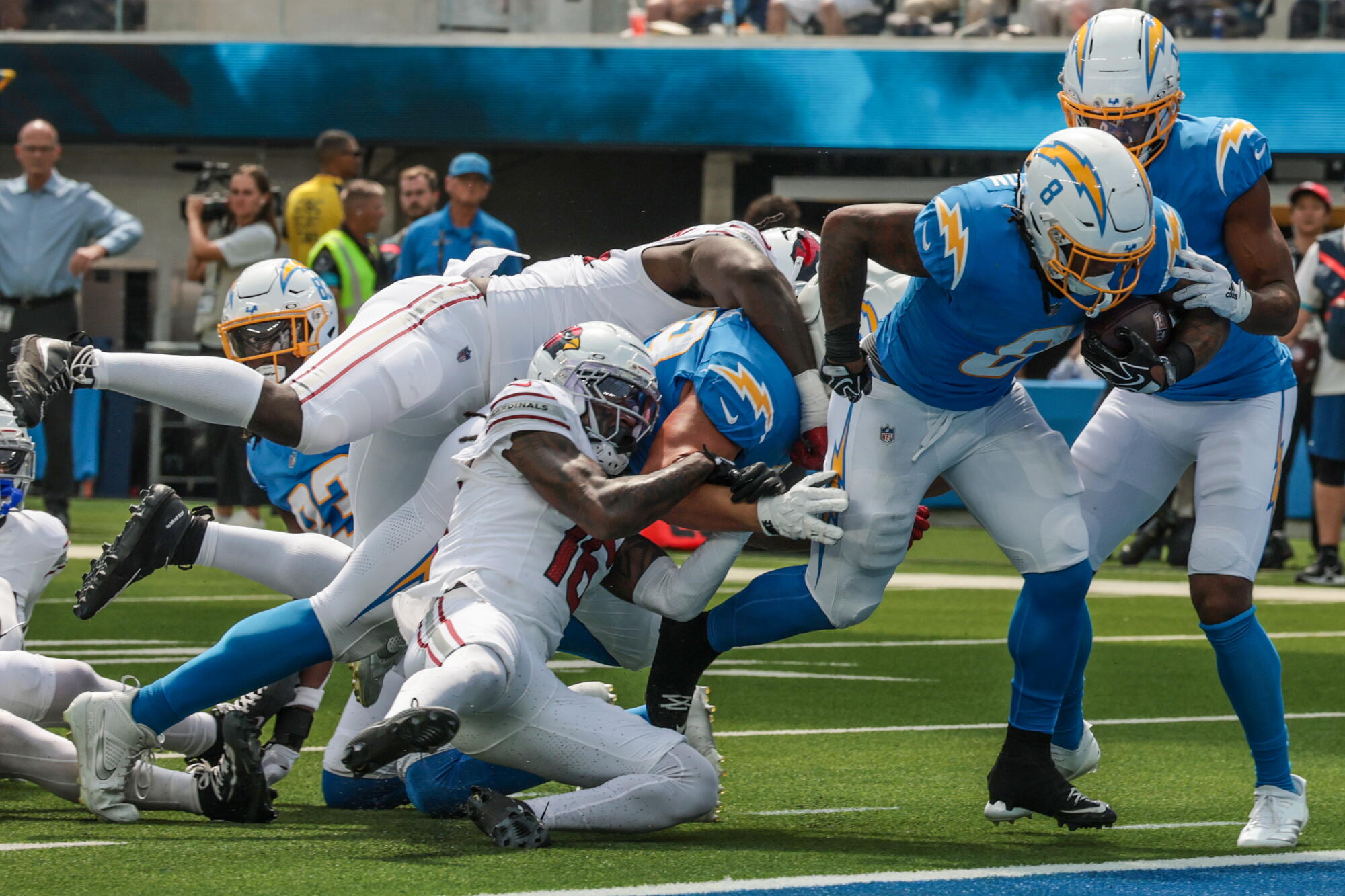 Chargers running back Omarion Hampton scores a touchdown in the first half against the Cardinals on Sunday.