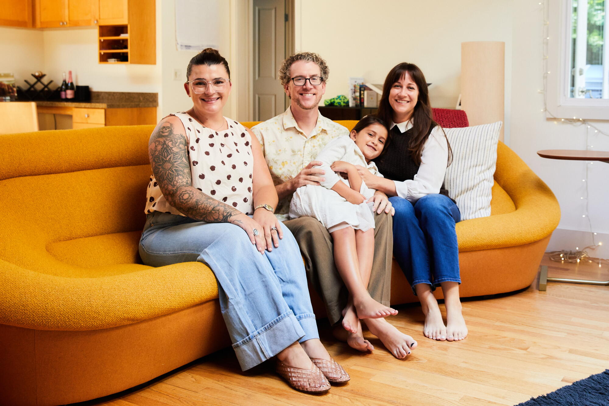 Emily Adel and her family at her home in Glendale posing with house manager Sabrina Thompson