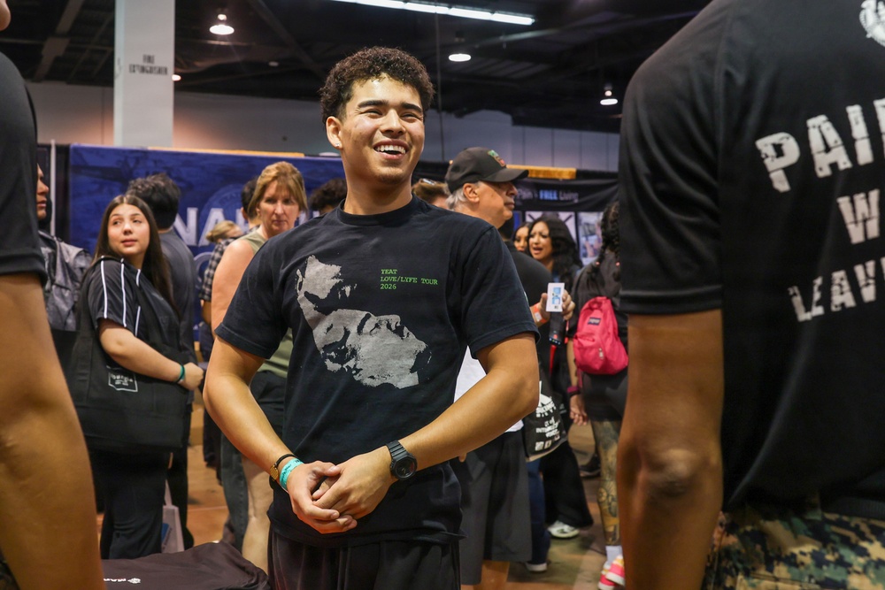 A young man wearing a black