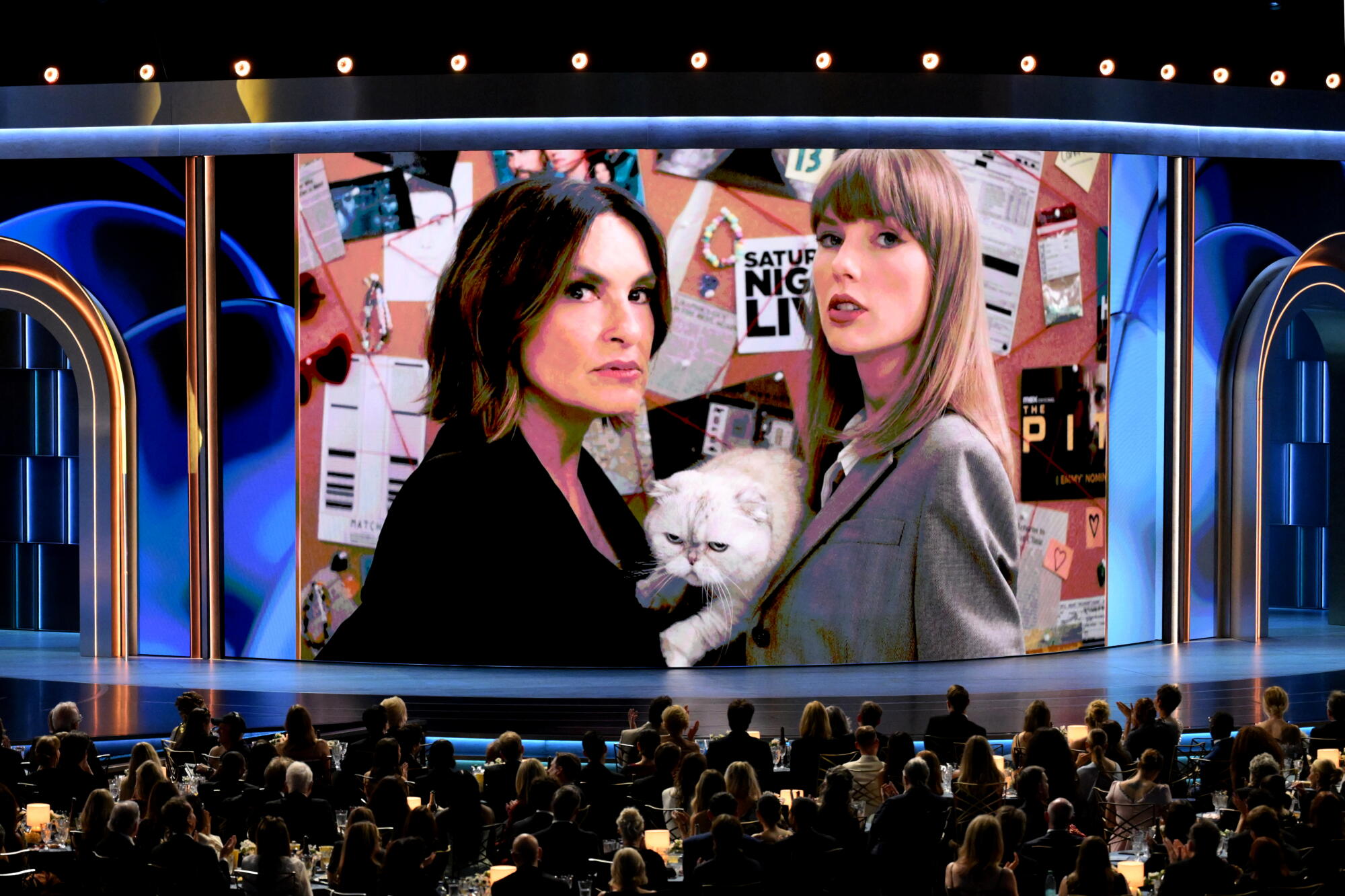 Emmys host Mariska Hargitay with singer Taylor Swift and her cat on screen during a skit the 78th Primetime Emmy Awards.
