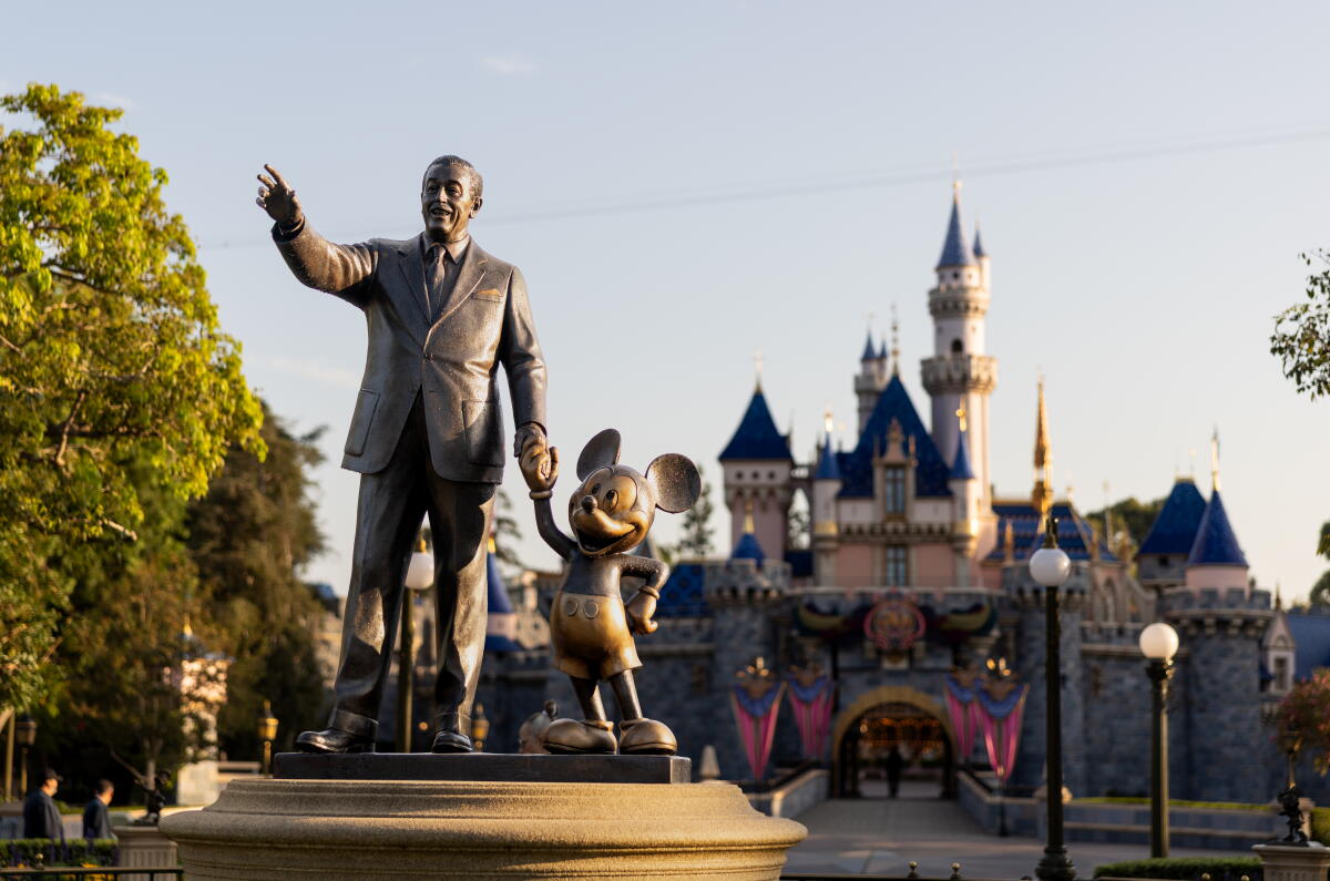A statue of Walt Disney and Mickey Mouse.