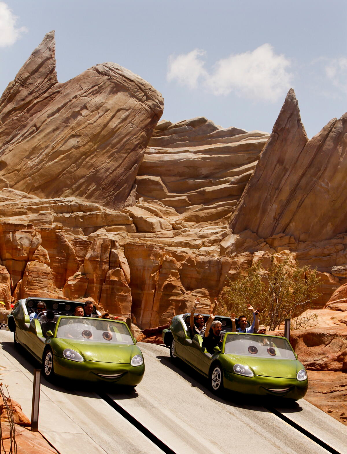 Visitors zoom on the ride Radiator Springs Racers.