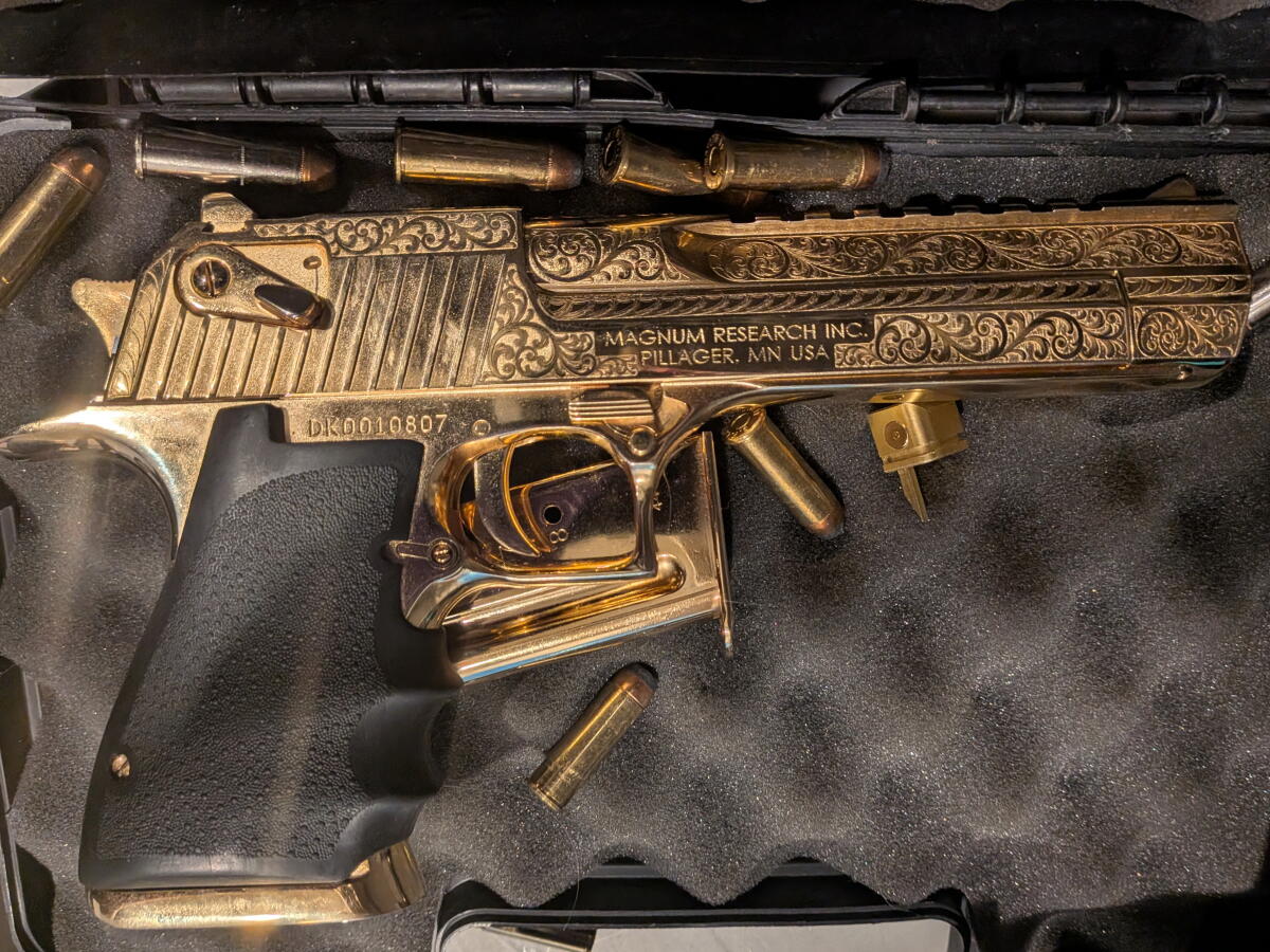 A gold-plated handgun was among the items recovered by federal agents.