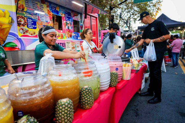 People enjoy Mexican food and aguas frescas during the 216th anniversary of Mexican Independence Day celebrations at San Jose City Hall in San Jose, Calif., on Tuesday, Sept. 15, 2026. Hundreds of people gathered for "El Grito," or "The Cry," which was delivered by Consul General of Mexico in San Jose, Neftali Said Pérez González, alongside San Jose Mayor Matt Mahan. (Ray Chavez/Bay Area News Group)