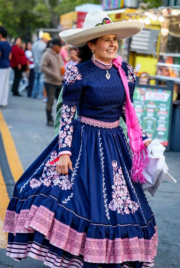 Patricia Rivera Esparza of San Jose, wears traditional Mexican ranchera clothing to honor the heritage passed down by her parentsa cultural tradition she now passes on to her children and grandchildren, she said, during the 216th anniversary of Mexican Independence Day celebrations at San Jose City Hall in San Jose, Calif., on Tuesday, Sept. 15, 2026. Hundreds of people gathered for "El Grito," or "The Cry," which was announced by Neftali Said Pérez González, consul general of Mexico in San Jose, alongside San Jose Mayor Matt Mahan. (Ray Chavez/Bay Area News Group)